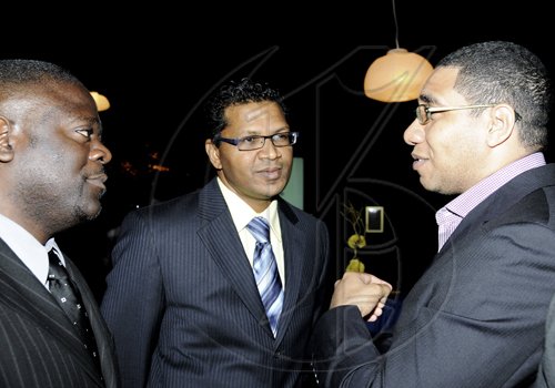 Winston Sill / Freelance Photographer
Education Minister Andrew Holness (right) in conversation with Richard Pandohie (centre), managing director of Carreras Limited and Christopher Brown, corporate and regulatory affairs manager at Carreras.

host reception to honour Michael Bernard on his retirement and to welcome Richard Pandohie, held at Terra Nova All-Suite Hotel, Waterloo Road on Wednesday December 29, 2010.