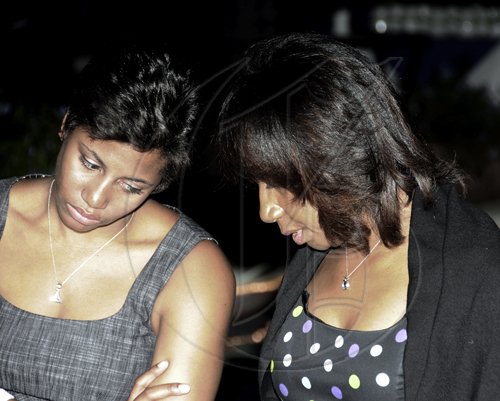 Winston Sill / Freelance Photographer
PSOJ CEO Sandra Glasgow (right) chats with daughter Lori-Ann.

*****************************************************************************************

Carreras Limited host reception to honour Michael Bernard on his retirement and to welcome Richard Pandohie, held at Terra Nova All-Suite Hotel, Waterloo Road on Wednesday December 29, 2010.