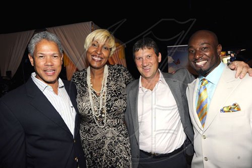 Rudolph Brown/Photographer
(From left) Donovan Perkins, president and CEO of PanCaribbean Financial Services; Kim Lee, Trade Winds' head of marketing; Peter McConnell, managing director of Trade Winds Citrus/Tru Juice Limited; and Garth Walker, director of Wealth Magazine get together for a pic.

 at the launch of Wealth Business Access TV show at the Terra Nova All-Suite Hotel on Tuesday.
, January 4-2011.