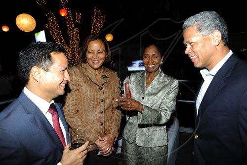 Rudolph Brown/Photographer
Donovan Perkins, (right) president and chief executive officer of Pan Caribbean Financial Services chat with from left Omar Azan, President of JMA, Suzanne Palomino, Head of Digicel Business Sales and Kay Osborne, General Manager of TVJ at the launch of their Wealth Business Access TV Show launch at the Terra Nova Hotel in Kingston on Tuesday, January 4-2011.