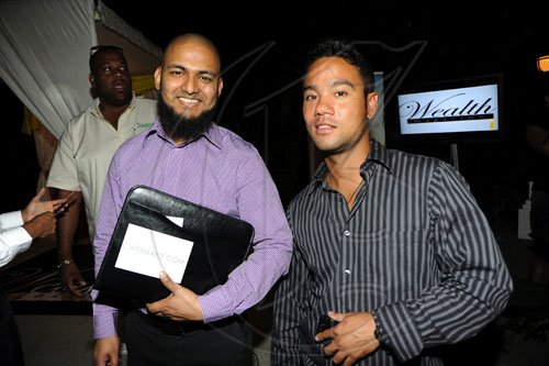 Rudolph Brown/Photographer
Ziva Rahaman, (left) Chairman and Matthew Moo, Regional Director Caraworks at the launch of their Wealth Business Access TV Show launch at the Terra Nova Hotel in Kingston on Tuesday, January 4-2011.