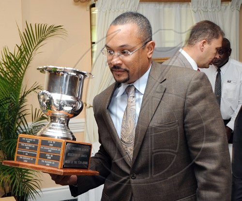 Rudolph Brown/Chief Photographer
Christopher Barnes,  deputy managing director of The Gleaner Company walk a way with the winning award for media of the year to The Gleaner's at AAAJ Media Awards 2009 at Knutsford Court Hotel  New Kingston. on Wednesday, June 10-2009