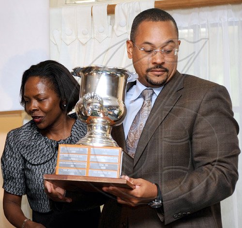 Rudolph Brown/Chief Photographer
Christopher Barnes,  deputy managing director of The Gleaner Company walk a way with the winning award for media of the year to The Gleaner's at AAAJ Media Awards 2009 at Knutsford Court Hotel  New Kingston. on Wednesday, June 10-2009