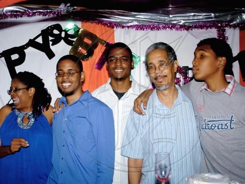 Winston Sill / Freelance Photographer
Angella Brown-Burke (left), celebrates her birthday with husband Paul (second right) and their children, Aliou  Burke, son;  nephew, Sean Holland and other son, Ajani Burke.

********************************************************************************family, friends and party colleague at party, held at The Quad, New Kingston on Monday night April 26, 2010. Here is the Family.