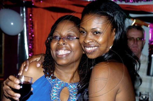 Winston Sill / Freelance Photographer
Angella Brown-Burke (left), gets a hug from sister Shelly Brown (right). 

*************************************************************************************Angella Brown-Burke celebrates her birthday with family, friends and party colleague at party, held at The Quad, New Kingston on Monday night April 26, 2010. Here are Angella (left) and sister Shelly Brown (right).