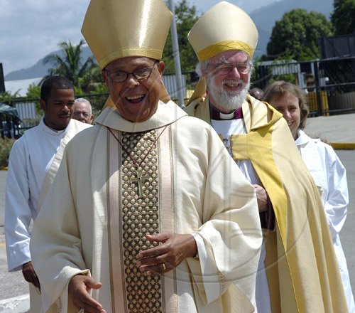Rudolph Brown/Chief Photographer
The Rt. Rev. Alfred Reid, (left) Bishop of Jamaica and the Cayman Islands and Archbishop of Canterbury The Most Rev. and Rt. Hon. Dr. Rowan Williams enter the National Arena for the Diocese of Jamaica and the Cayman Islands, Order of Service on the occasion of the meeting of the Anglican Consultative Council on Sunday, May 3-2009.