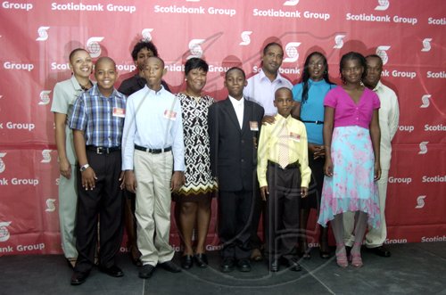 Gladstone Taylor / Photographer

front row; left to right : Russel, Gordon, Daniel Lawla, Matthew campbell, Kyle Sahadath, shania Owens

Backrow; left tor ight: Doreen Cushnie, Althea Lawla, Georgia Chamberlian, Jushua Sahadath, Valerie Warmington, Winston Owens

as seen at the Scotia Jamaica Foundation Shining Star Scholarship awards luncheon on August 26, 2010