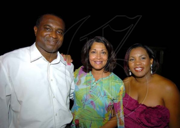 Winston Sill / Freelance Photographer
Businessman Richard Parchment chills with wife Lavern (right) and Tamara Hill.

American Women's Group (AWG) host Fundraising Dinner, held at Mark Way, Cherry Gardens on Thursday night December 17, 2009.