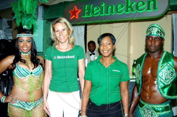 Frederique Asberg, Heineken's country manager (second left) and Kerri-Ann McKenzie (second right), Heineken's brand manager, are sandwhiched  by models Alexis Nunes and Anthony Grant who are wearing the company's sponsored costume-

*********************************************************************** Emeralds of Chivor. They were at the launch of Bacchanal Jamaica 2010.

Winston Sill / Freelance Photographer
Launch of Bacchanal Jamaica 2010 Carnival Season, under the theme "Bacchanal Treasures", held at Knutsford Court Hotel New Kingston on Wedneday January 20, 2010.