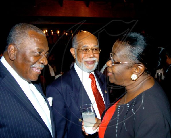 Winston Sill / Freelance Photographer
Conferment of the Order of the Civil Merit of Spain on Edmund Bartlett, Minister of Tourism, at a reception hosted by Ambassador Jesus Silva and Sara Silva, held at Norbrook Road on Friday night May 7, 2010. Here are  Godfrey Dyer (left); Lionel Reid (centre); and Dorothy Carter-Bradford (right).