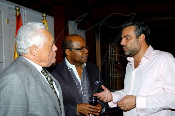 Winston Sill / Freelance Photographer
Conferment of the Order of the Civil Merit of Spain on Edmund Bartlett, Minister of Tourism, at a reception hosted by Ambassador Jesus Silva and Sara Silva, held at Norbrook Road on Friday night May 7, 2010. Here are  Minister Mike Henry (left); Ed. Bartlett (centre); and Ambassador Silva (right).