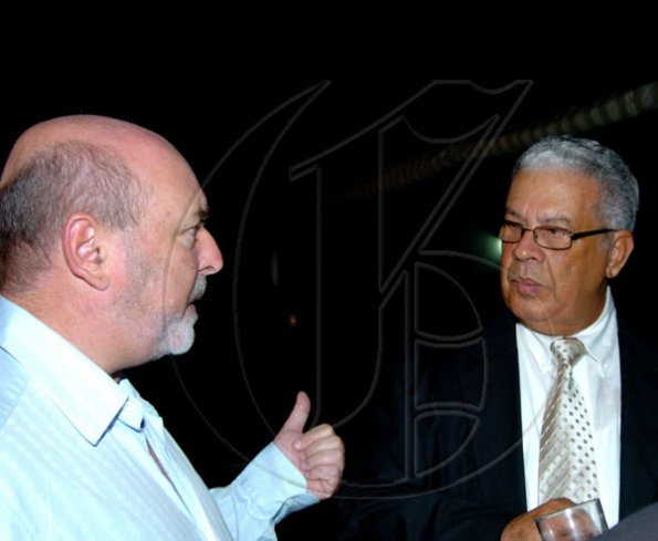 Winston Sill / Freelance Photographer
Conferment of the Order of the Civil Merit of Spain on Edmund Bartlett, Minister of Tourism, at a reception hosted by Ambassador Jesus Silva and Sara Silva, held at Norbrook Road on Friday night May 7, 2010. Here are Mark Kerr-Jarrett (left); and Winston Dear (right).
