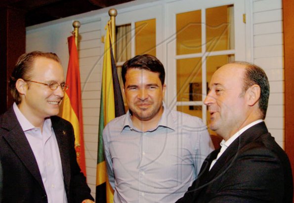 Winston Sill / Freelance Photographer
Conferment of the Order of the Civil Merit of Spain on Edmund Bartlett, Minister of Tourism, at a reception hosted by Ambassador Jesus Silva and Sara Silva, held at Norbrook Road on Friday night May 7, 2010. Here are  Philipp Hofer (left), Managing Director, Iberostar Resort; Rafael Matas (centre), of Excellence Group; and Miguel Angel Cano (right), Managing Director, Gran Bahia Principe.