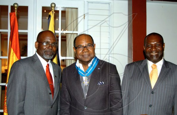 Winston Sill / Freelance Photographer
Conferment of the Order of the Civil Merit of Spain on Edmund Bartlett, Minister of Tourism, at a reception hosted by Ambassador Jesus Silva and Sara Silva, held at Norbrook Road on Friday night May 7, 2010. The three brothers, from left are St. Aubyn Bartlett; Ed Bartlett; and Alexander Bartlett.