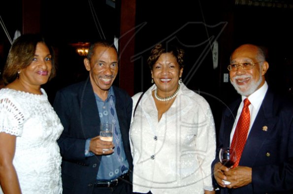 Winston Sill / Freelance Photographer
Conferment of the Order of the Civil Merit of Spain on Edmund Bartlett, Minister of Tourism, at a reception hosted by Ambassador Jesus Silva and Sara Silva, held at Norbrook Road on Friday night May 7, 2010. Here are  Joy Roberts (left); Kent Pantry (second left); Rosie Johnson (second right); and Lionel Reid (right).