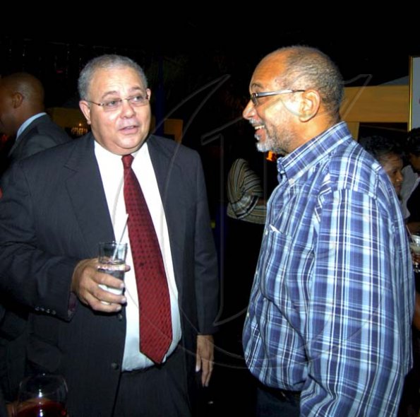 Winston Sill / Freelance Photographer
John Leiba (left) looks like we caught him offguard but Michael Mansoor (centre) chairman of FirstCaribbean and GraceKennedy boss Douglas Orane are picture ready.
Bank Farewell Function for Christopher Bovell, held at the Jamaica Pegasus Hotel, New Kingston night December 17, 2009.