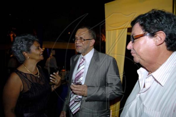Winston Sill / Freelance Photographer
Jean Bell (left) gets Clovis Metcalfe engrossed in conversation while Anthony Bell just takes it all in.

First Caribbean Bank Farewell Function for Christopher Bovell, held at the Jamaica Pegasus Hotel, New Kingston night December 17, 2009.