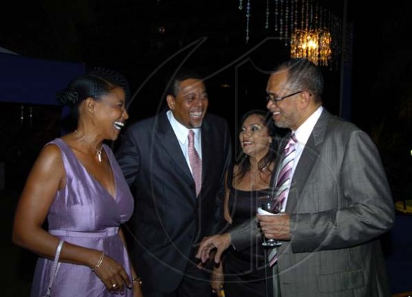 Winston Sill / Freelance Photographer
FirstCaribbean's Clovis Metcalfe (right) and Marlene Williams (second right) welcome Laurie Broderick and companion Sandy Gregory to the farewell.
Bank Farewell Function for Christopher Bovell, held at the Jamaica Pegasus Hotel, New Kingston night December 17, 2009.