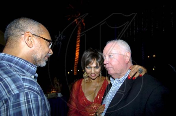 Winston Sill / Freelance Photographer
GraceKennedy boss Douglas Orane (left) adds his congratulations to former director of FirstCaribbean International Bank Christopher Bovell with Bovell's wife Michelle in close attendance.
, held at the Jamaica Pegasus Hotel, New Kingston night December 17, 2009.