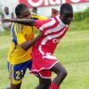 Norman Grindley/Chief Photographer
Boys Town's Marvin Morgan shields the ball from Harbour View's Daveion Woodhouse during their Claro Champion League game yesterday at Collie Smith Drive. Boys Town won 3-1.