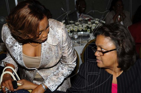 Rudolph Brown/Photographer
Heather Robinson, (right) chat with Beverley Ferguson-Smith at the Sagicor Life Jamaica Half Way Tree branch annual awards breakfast at the Jamaica Pegasus Hotel in New Kingston on Friday, March 26-2010.