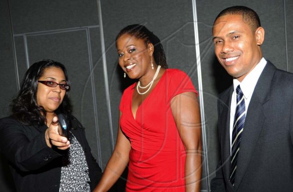 Rudolph Brown/Photographer
Sandra Fairclough, (centre) chat with Ainsley Watson and Nadia Brown at the Sagicor Life Jamaica Half Way Tree branch annual awards breakfast at the Jamaica Pegasus Hotel in New Kingston on Friday, March 26-2010.