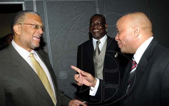 Rudolph Brown/Photographer
Mark Chrisholm, (right) V.P Individual Line Division of Sagicor Life and Marston Thomas, Branch Manager greets guest speaker Dr. Peter Phillips at the Sagicor Life Jamaica Half Way Tree branch annual awards breakfast at the Jamaica Pegasus Hotel in New Kingston on Friday, March 26-2010.