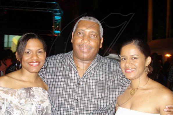 Barbara Ellington/Lifestyle Editor
National Commercial Banks  Rickert Allen is in the seventh heaven as he gets to hug Tishan Lee (left) and Sheree Martin.

*******************************************************************a Brigitte's birthday party held at Earl's Court, St. Andrew on Saturday November 7, 2009.