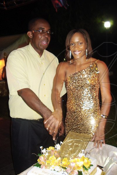 Barbara Ellington/Lifestyle Editor
Brigitte Foster-Hylton gets ready to cut her birthday cake with husband, Patrick at their home on in Earl's Court, St. Andrew on Saturday night.

***************************************************************************************************November 7, 2009.