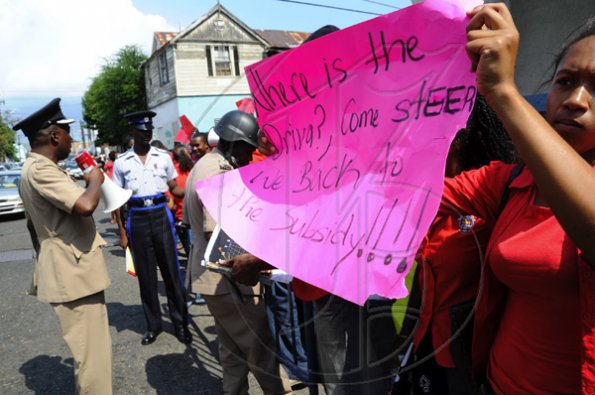 Ricardo Makyn/Staff Photographer.
University Students protesting against Minister of Education Andrew Holness because of the withdrawal of a subsidy to Tertiary level Students  on Tuesday 13.4.2010
