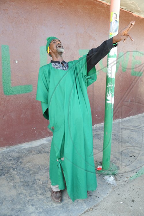 Ricardo Makyn/Staff Photographer
A JLP supporter in Riversdale By-election - N.E. St. Catherine