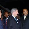 Rudolph Brown/Chief Photographer
Prime Minister Bruce Golding (secon left) welcomes Canadian Prime Minister Stephen Harper, (centre) to Jamaica shortly after both leaders landed at the Norman Manley International Airport yesterday. Harper and Golding  were returning from the Fifth Summit of the Americas which was held in Trinidad and Tobago. Harper is on an official visit to Jamaica.