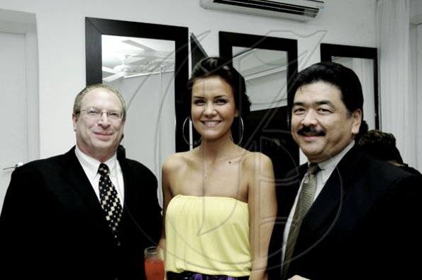 Winston Sill / Freelance Photographer
The gorgeous designer Lubica shines between David Yamada (right) and Johnathan Kastner.


Caribbean Fashion Week (CFW) Opening Reception, held at Spanish Court Hotel, New Kingston on Thursday night June 9, 2011.