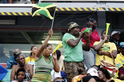 Aderian Frater photo
Jamaican fans celebrate another success on the final afternoon of the LIME CARIFTA Games, at the Montego Bay Sports Complex, St James, yesterday.