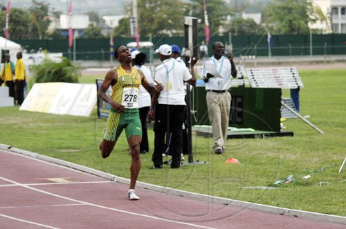 Adrian Frater photo
Orane Wint is alone at the finish line as he takes gold for Jamaica in the boys' Under-20 5000 metres, on yesterday final afternoon of the LIME CARIFA Games at the Montego Bay Sports Complex, St James.