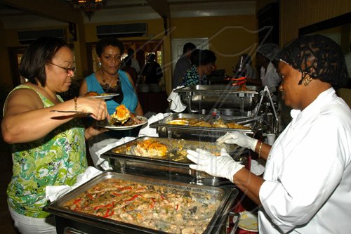 Colin Hamilton/freelance photographer
Mothers Day Brunch at the Morgans Harbour Hotel on Sunday May 10, 2009.  Mrs Ena Blythe adds one of the scrumptious dishes to her plate while Judith Brown awaits her turn looking on at right is Maxine McDonald.