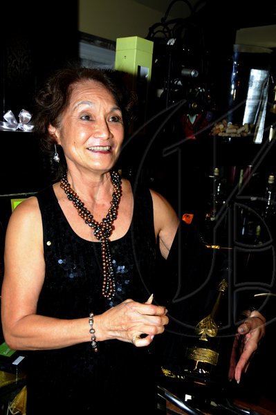 Winston Sill / Freelance Photographer
Thaila Lyn is the first person to purchase a bottle the world number one champagne. 


**********************************************************
Launch of Armand De Brignac Champagne, held at Bin 26, Devon House, Hope Road on Tuesday night July 5, 2011.