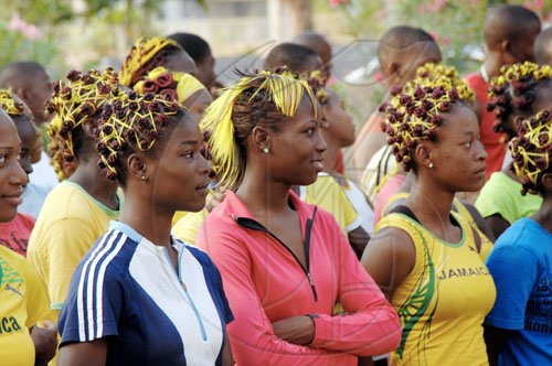 Ian Allen/Staff Photographer
Members of Holmwood Technical High School's athletics team show off their new Champs hairstyles during the first day of the Boys and Girls' Athletics Championships at the National Stadium yesterday.