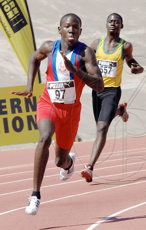 Ian Allen/Staff Photographer
Bridgeport High School's Jazeel Murphy leads the field off the turn in the Class Two boys 200m heats, on the opening day of the ISSA/GraceKennedy Boys and Girls' Athletics Championships, at the National Stadium yesterday. Murphy, the gold medal favourite, won in 21.47 seconds, the fastest time recorded over the half-lap event for the day.