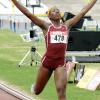 Ian Allen/Staff Photographer
Holmwood Technical High's outstanding Class Three girl, Chris-Ann Gordon, celebrating victory in the 800 metres final on the last day of the GraceKennedy/ISSA Boys' and Girls' Championships at the National Stadium yesterday. Gordon scored a runaway victory in 2:13.45 to help Holmwood to their seventh straight girls' title at the annual championships. MORE ON B1.