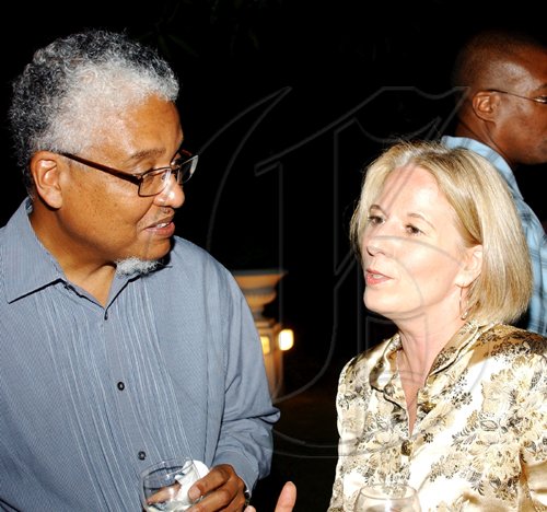 Winston Sill / Freelance Photographer
E Nigel Harrie, Vice Chancellor,  University of the West Indies in conversation with Dr Barbara Munske wife of British High Commissioner Jeremy Cressweel.

********************************************************************* British High Commissioner Jeremy  Cresswell host reception for Chevening Scholars, held at Trafalgar House, Trafalgar Road on Wednesday night September 9, 2009.