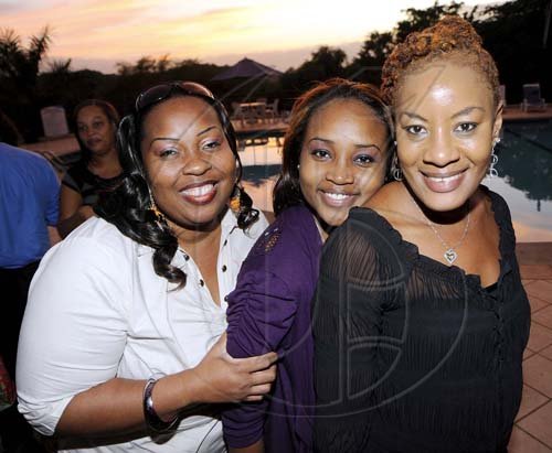 Rudolph Brown/Photographer
From left: Lucy Schloss-Smith, Sherece Moulton and Andrea Clarke show their radiant smiles.

**************************************************************************************************************at the St. Catherine Co-operative Credit Union Christmas awards luncheon at Caymanas Golf and Country Club on Wednesday, December 22-2010