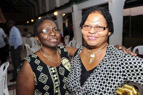 Rudolph Brown/Photographer
Lois Cooper, (left) human resources manager spends time with  Blanch Hylton.

******************************************************************** at the St. Catherine Co-operative Credit Union Christmas awards luncheon at Caymanas Golf and Country Club on Wednesday, December 22-2010