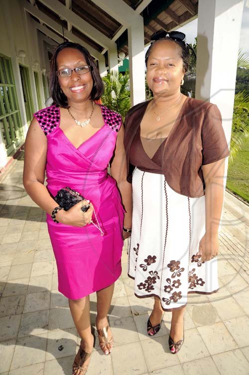 Rudolph Brown/Photographer
Genaral Manager Sandra Thompson (right) and  Yvonne Purcellarrive for the luncheon.

************************************************************ at the St. Catherine Co-operative Credit Union Christmas awards luncheon at Caymanas Golf and Country Club on Wednesday, December 22-2010