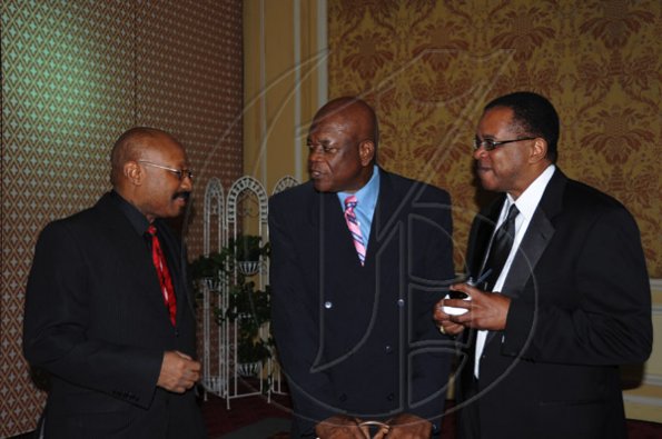 Publication: Social/Something Extra
Photo by Noel Thompson

Attorney-at-law Clayton Morgan (centre), talks with longtime colleagues Murrio Ducille (left), a Jamaican lawyer based in the Bahamas and Eric Rose, also a Jamaican born lawyer, living in Fort Lauderdale, Florida, U.S.A. Ducille and Rose were attending a celebration dinner held in honour of Clayton Morgan, at the Ritz Carlton Resort, Montego Bay, last Saturday (December 5, 2009).