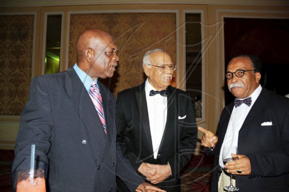 Publication: Social/Something Extra
Photo by Noel Thompson

Clayton Morgan (left), chats with learned friends Ripton McPherson (centre) and Courtney Hamilton, during a celebration dinner held in honour of Morgan, at the Ritz Carlton Resort, Montego Bay, last Saturday (December 5, 2009).