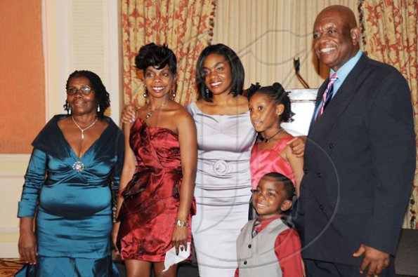 Publication: Social/Something Extra
Photo by Noel Thompson

Clayton Morgan pose with his family for a photo. From left are wife Doris; daughters Nneka Morgan-Sutton and Michel Morgan and grand children Jelani Morgan-Sawyers and Daneik Morgan. Occasion was a celebration dinner held in honour of Clayton Morgan, at the Ritz Carlton Resort, Montego Bay, last Saturday (December 5, 2009).
