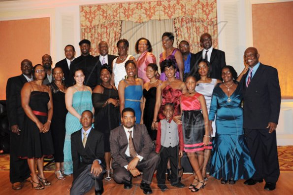 Publication: Social/Something Extra
Photo by Noel Thompson

The Morgan's family pose for a photo, during a celebration dinner held in honour of attorney Clayton Morgan, (far right) at the Ritz Carlton Resort, Montego Bay, last Saturday (December 5, 2009).