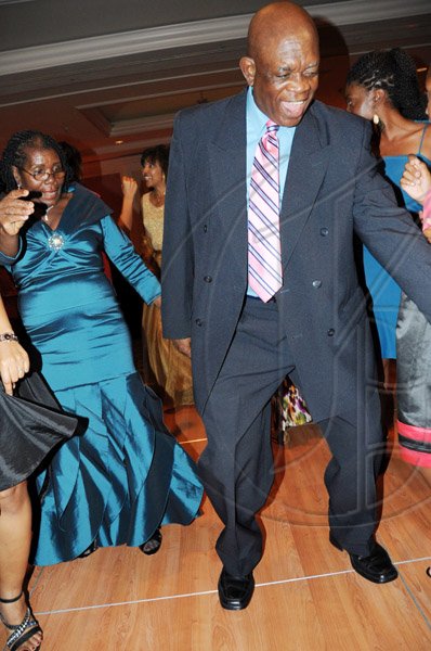 Publication: Social/Something Extra
Photo by Noel Thompson

Attorney Clayton Morgan throwing some legs on the dance floor, following a celebration dinner held in his honour at the Ritz Carlton Resort, Montego Bay, last Saturday (December 5, 2009). In background is his wife Doris, also on the dance floor.
