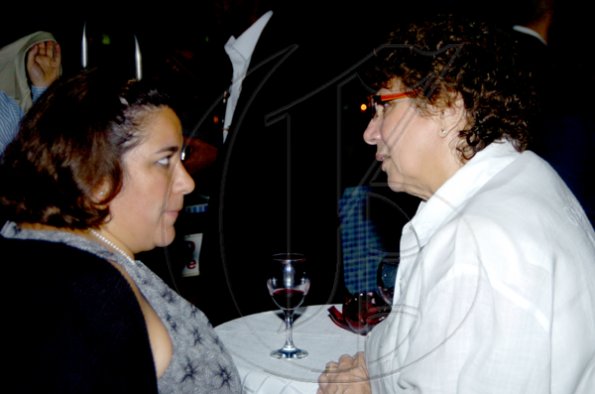 Winston Sill / Freelance Photographer
Maria Giraldo (left), Colombian consul, and Marta Anador from the Cuban embassy talk things over.

Consular Corps host Cocktail Reception to say farewell to the British High Commissioner, held at Spanish Court Hotel, New Kingston on Wednesday december 2, 2009.